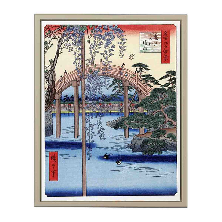 Footbridge over river with wisteria in foreground in full bloom