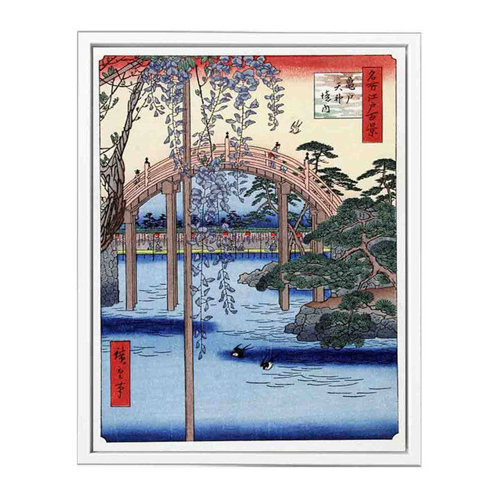 Footbridge over river with wisteria in foreground in full bloom