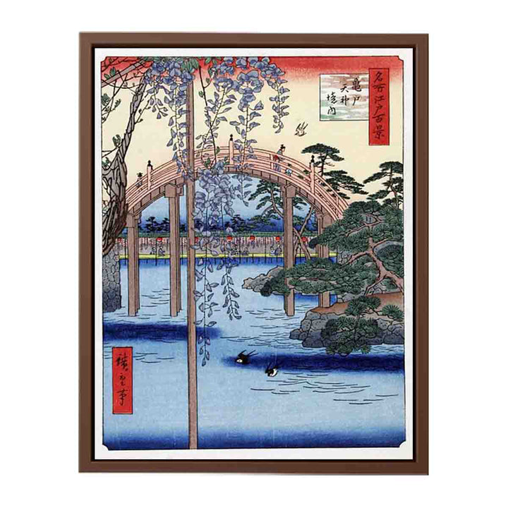Footbridge over river with wisteria in foreground in full bloom