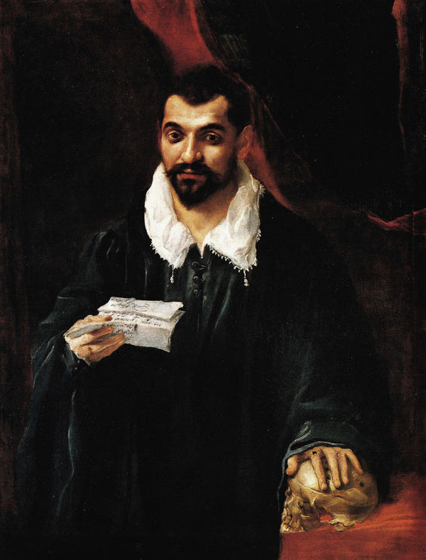 Portrait of a man holding a skull 