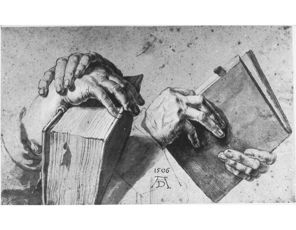 Two Hands Holding A Pair Of Books